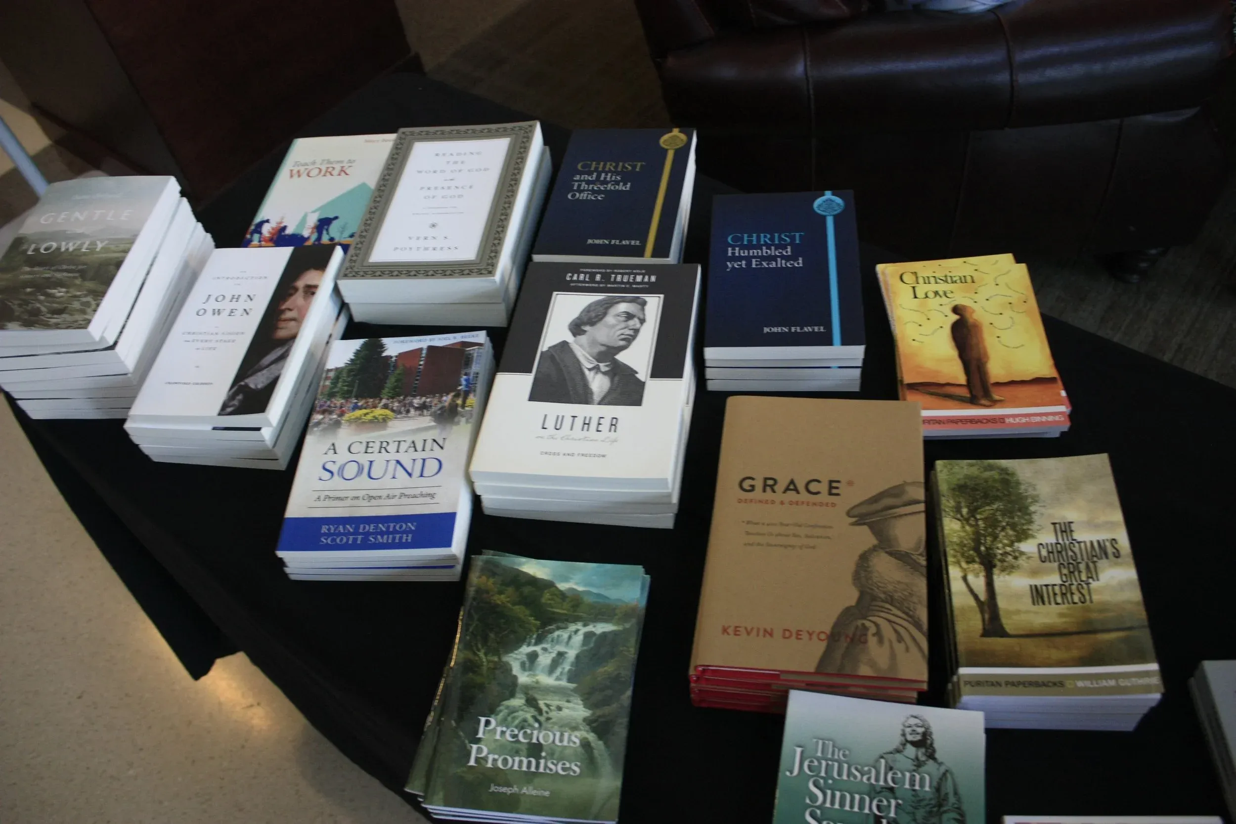 The church book table stacked with Puritan paperbacks and theology titles